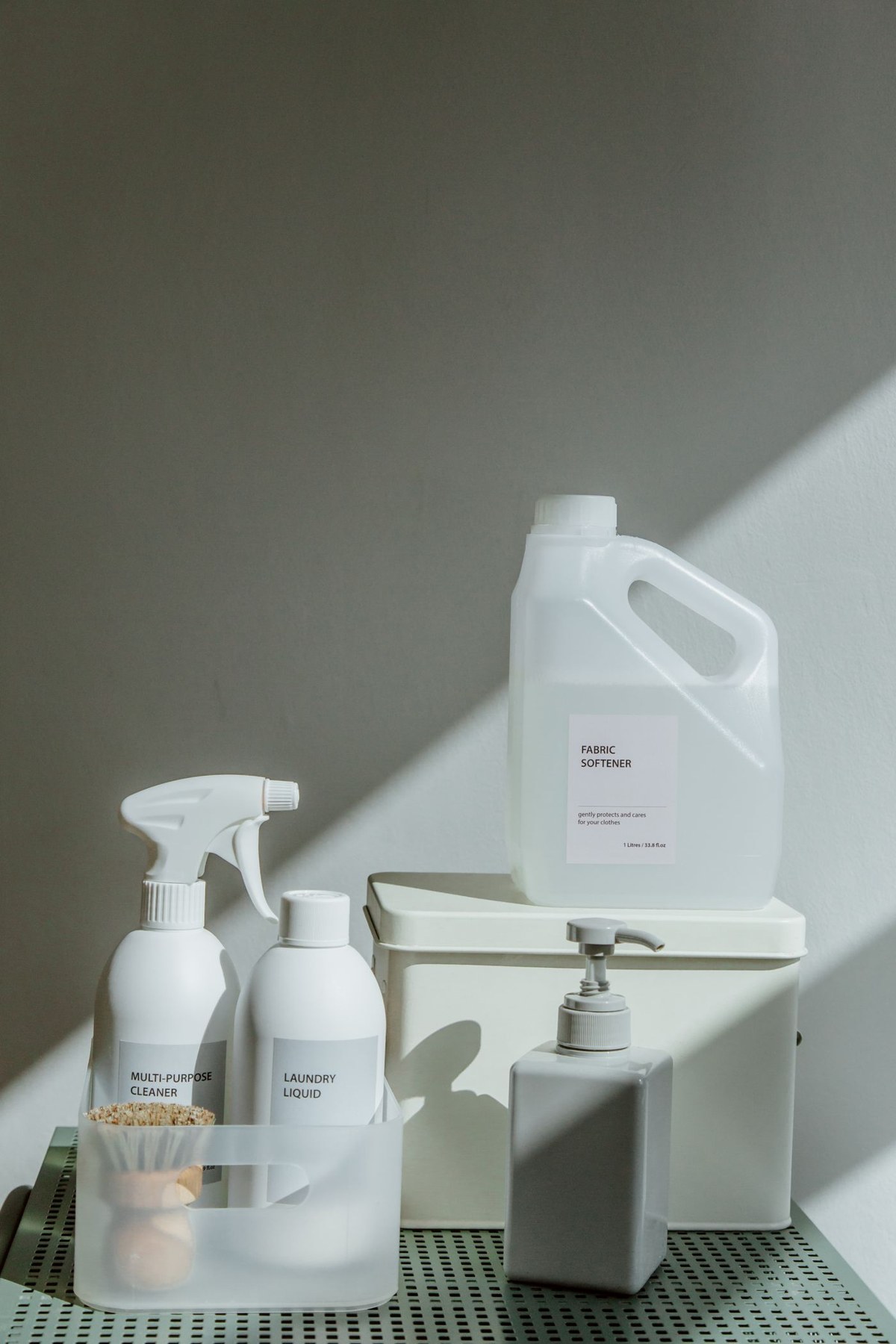 Cleaning bottles and brushes arranged in a small caddy