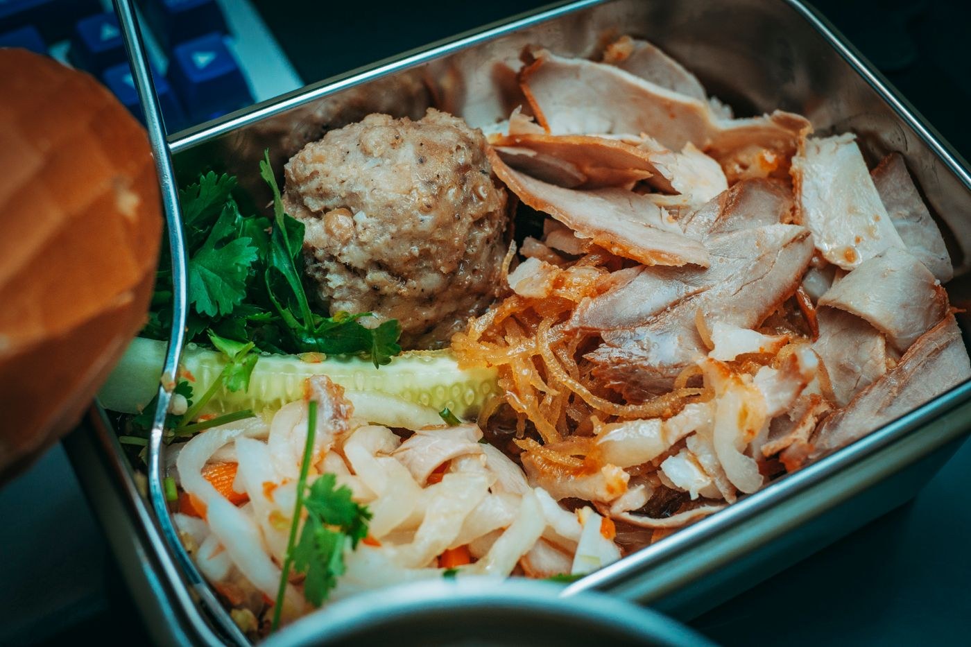 A packed meal in a metal lunch box