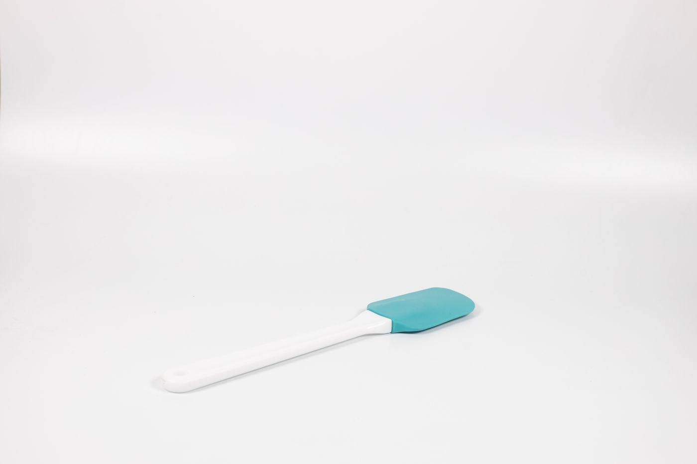 A silicone spatula on a white background