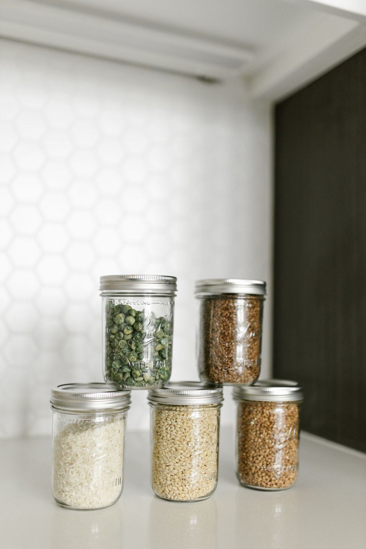 Food stored in glass jars on a shelf