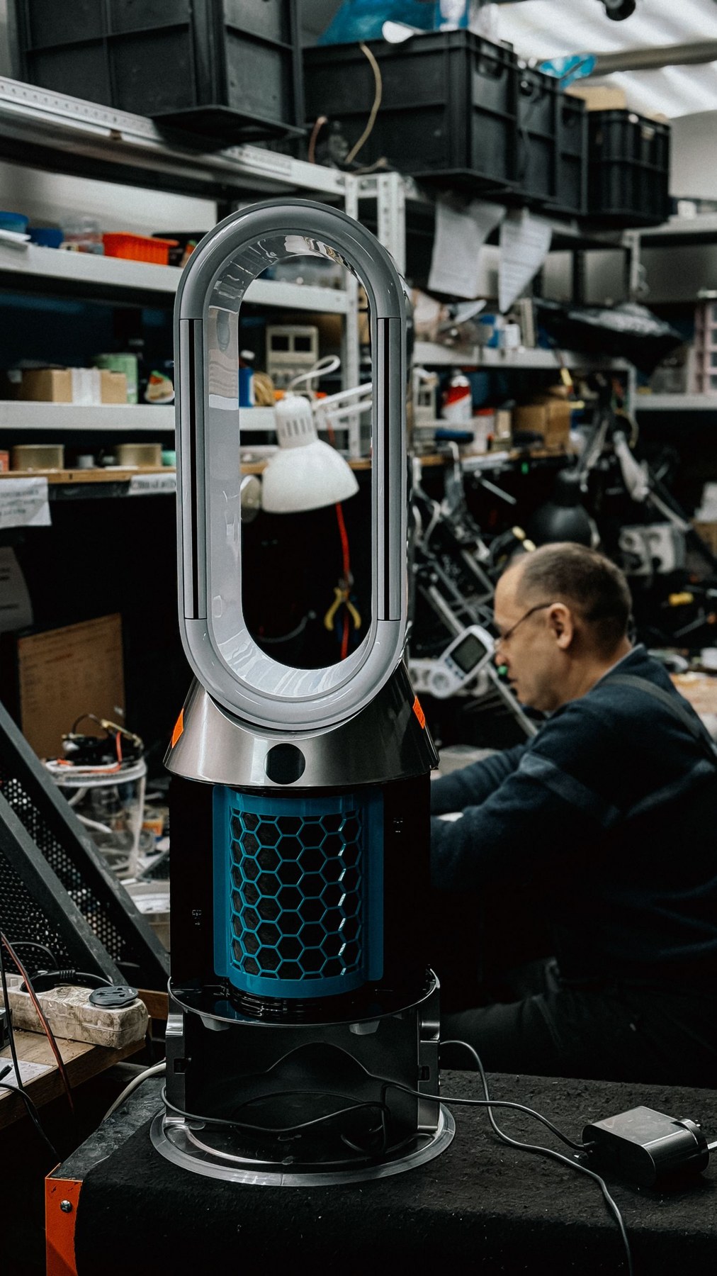 A room air-cleaning appliance on a workbench