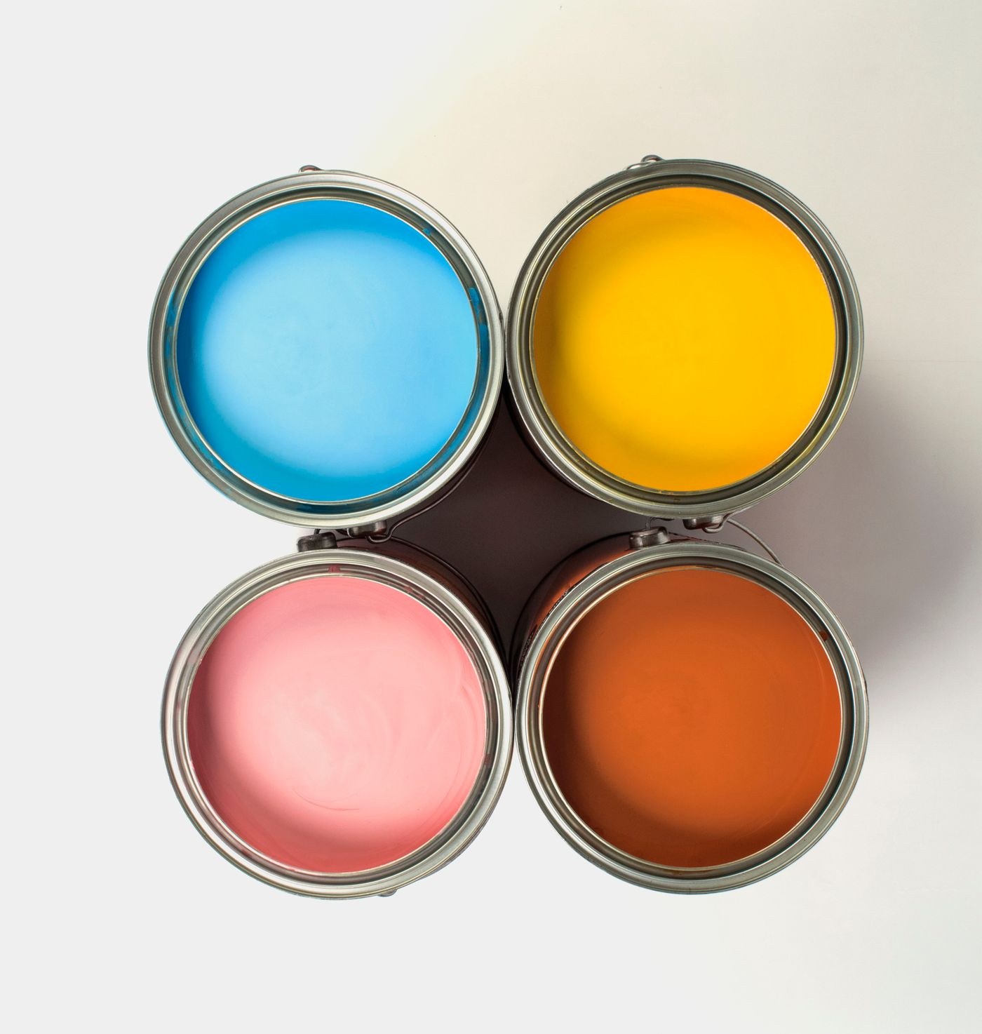 Open tins of different paint colours
