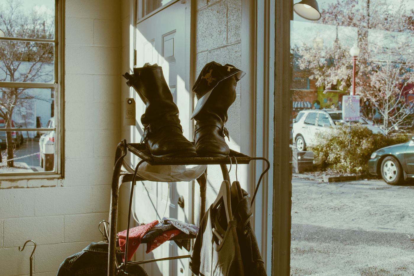 Boots on a rack beside a doorway