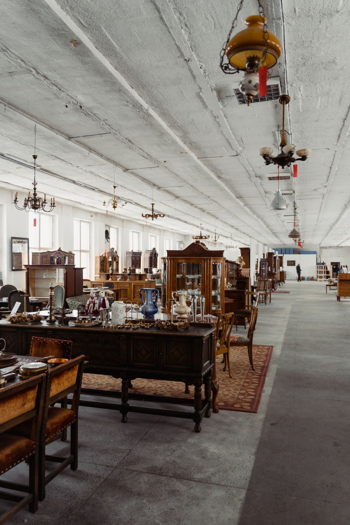 Second-hand wooden furniture displayed in an antique shop